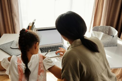 Parent and child at laptop