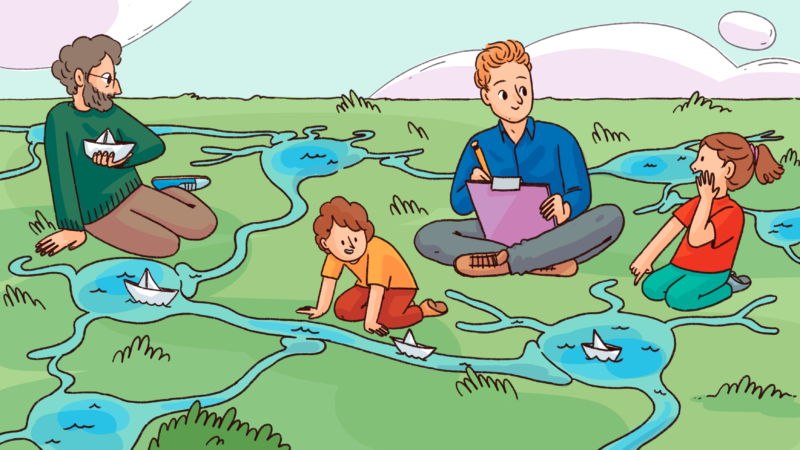 A researcher interacts with a family who are playing together.