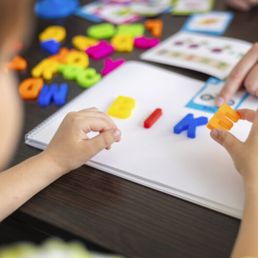 A child is learning how to spell.