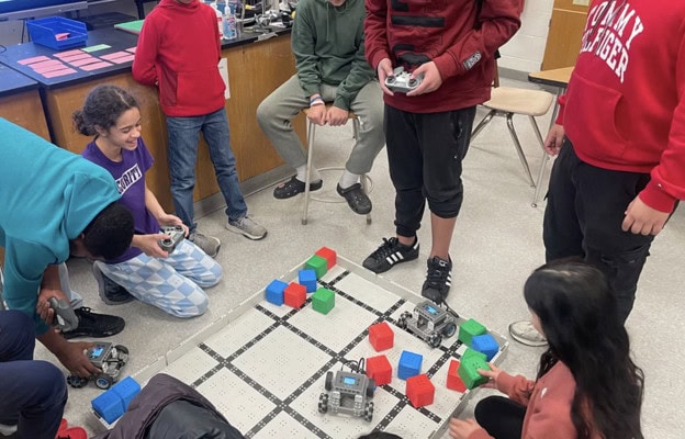 Students learn about robotics in an interactive classroom session.