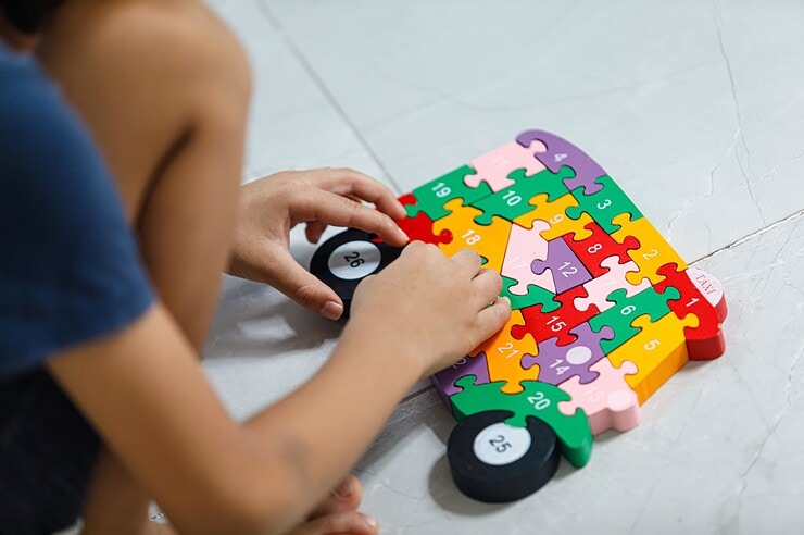 A child is doing a puzzle.